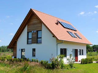 Fertighaus Kathrin (KfW-Effizienzhaus 40 EE) von Dammann-Haus Schlüsselfertig ab 331200€, Satteldach-Klassiker Außenansicht 1