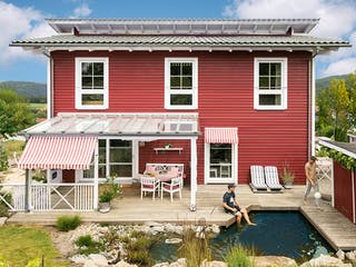 Fertighaus E 20-168.1 - Fertighaus im skandinavischen Landhausstil & Hampton-Flair von SchwörerHaus, Außenansicht 3